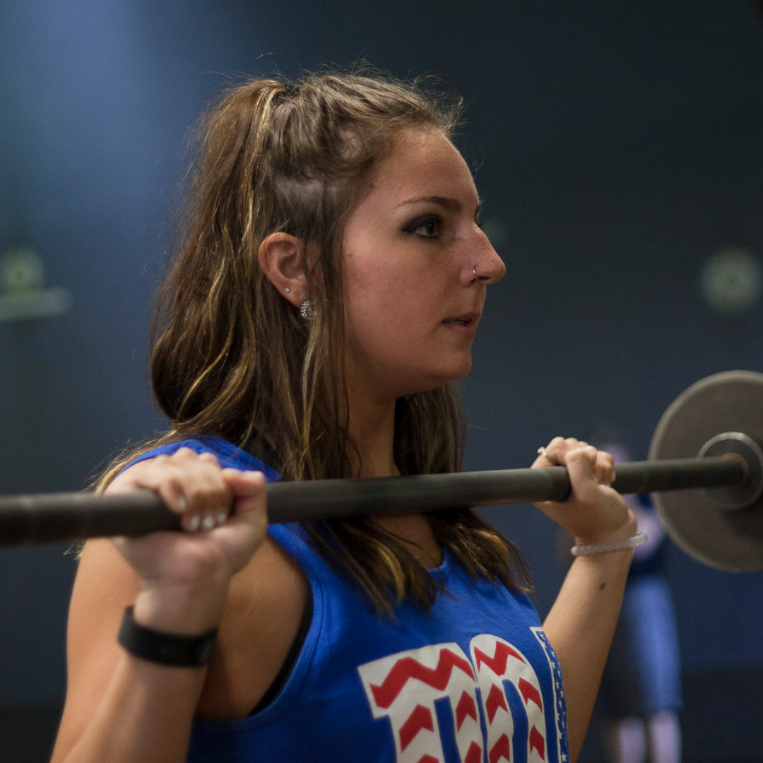 Female Student Lifting Weights 